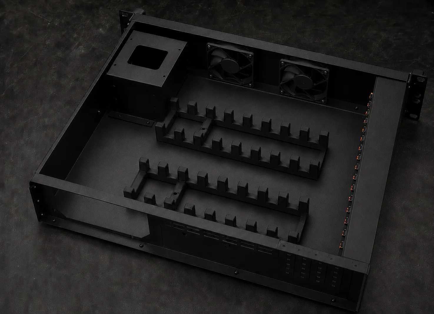 Rackmount phone farm deck with the lid removed, showing the slotted device cradles, cooling fans and power supply bay